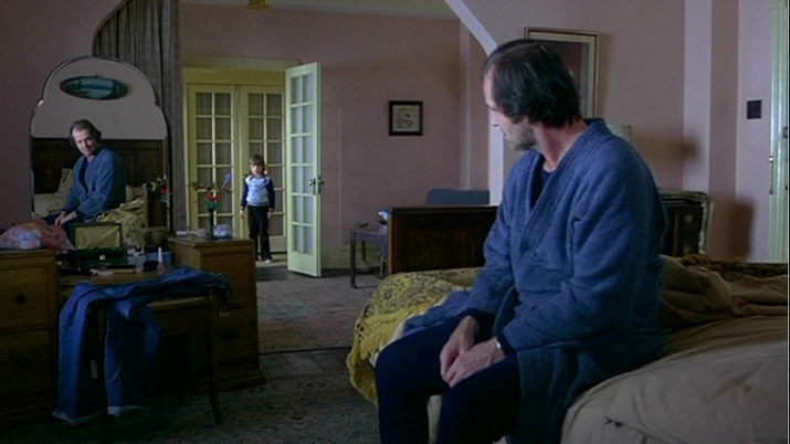 Jack sits on the bed in room 237 of The Overlook Hotel