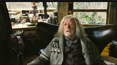 Michael Caine sits in an Egg chair in Children of Men