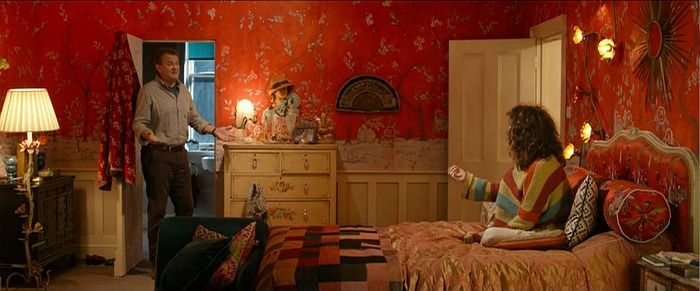 Mrs Brown's red room features a Wallace and Sewell 'Kandinsky Chenille Patchwork' throw on the bed