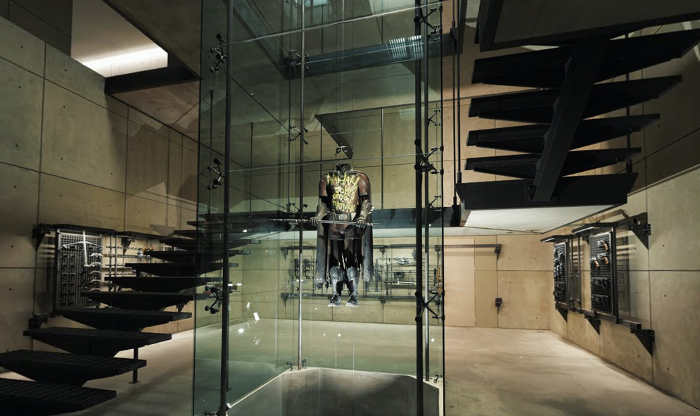 Robin's costume can be seen in a glass case in a room full of armoury