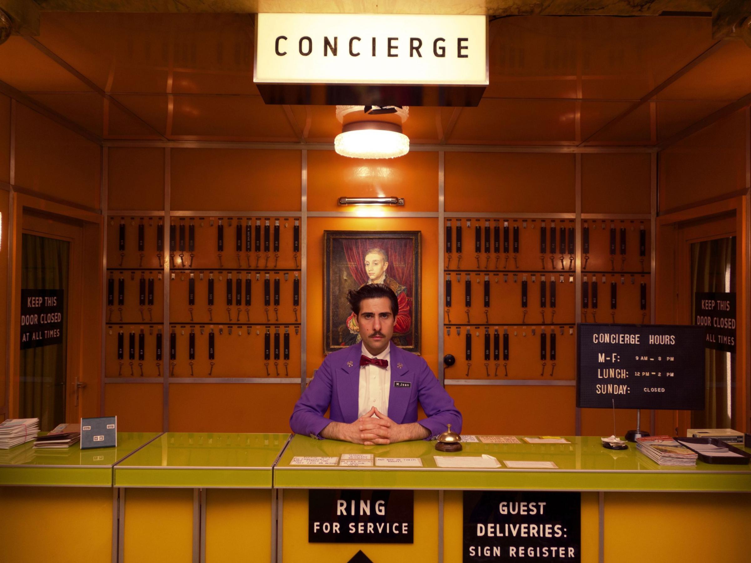 Boy With Apple painting residing behind the Concierge desk in the 1960s version of the Grand Budapest Hotel art in film