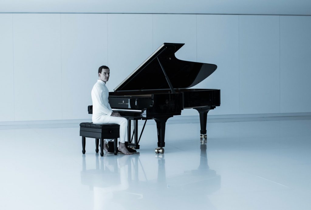 David seated at the Steinway piano in Alien Covenant