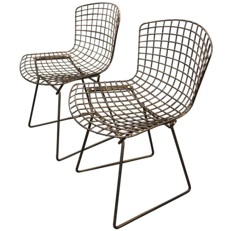 Pair of vintage black Harry Bertoia wire dining chairs priced at £898 from Pamono >